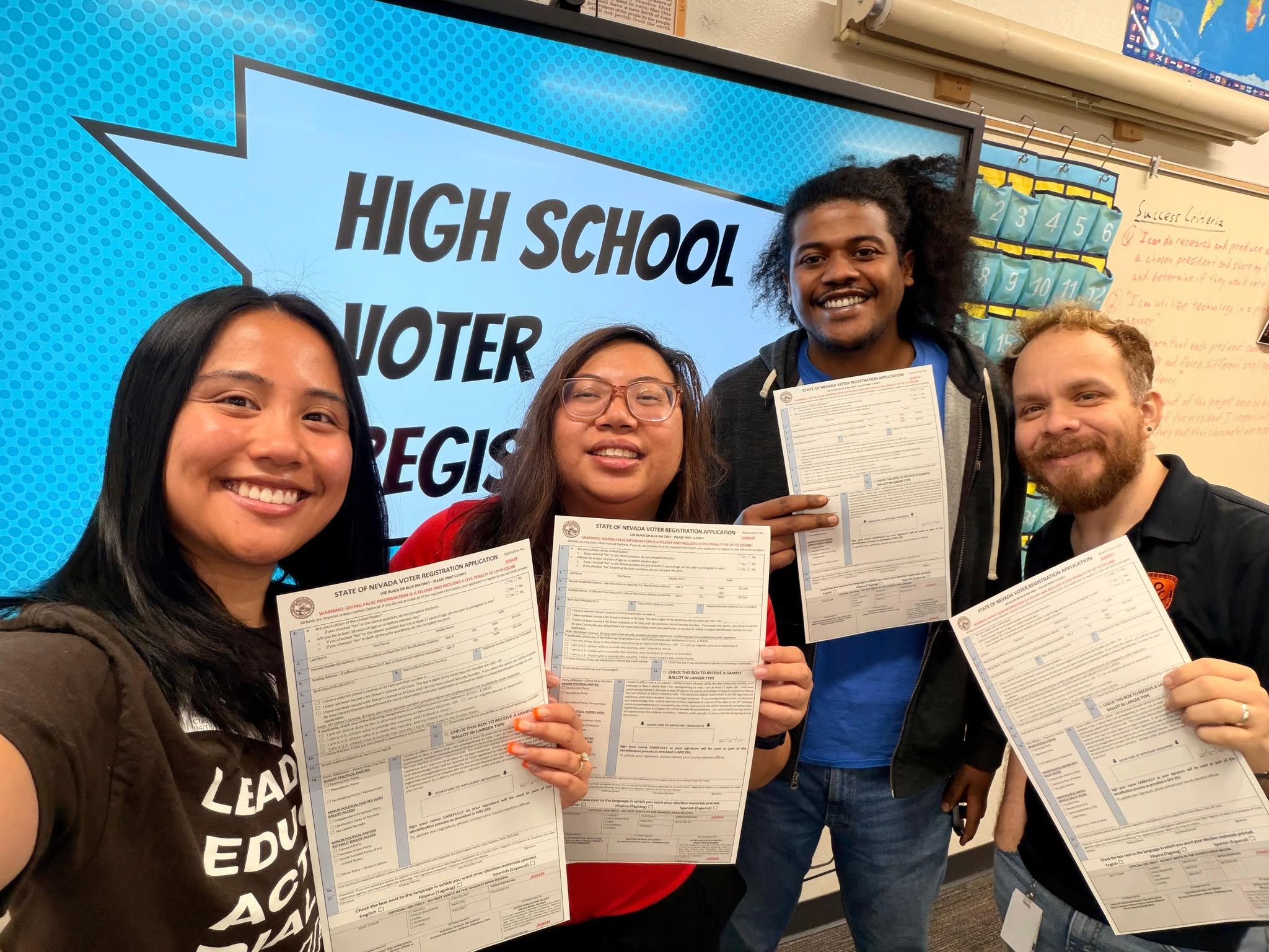 Students holding voter registration forms