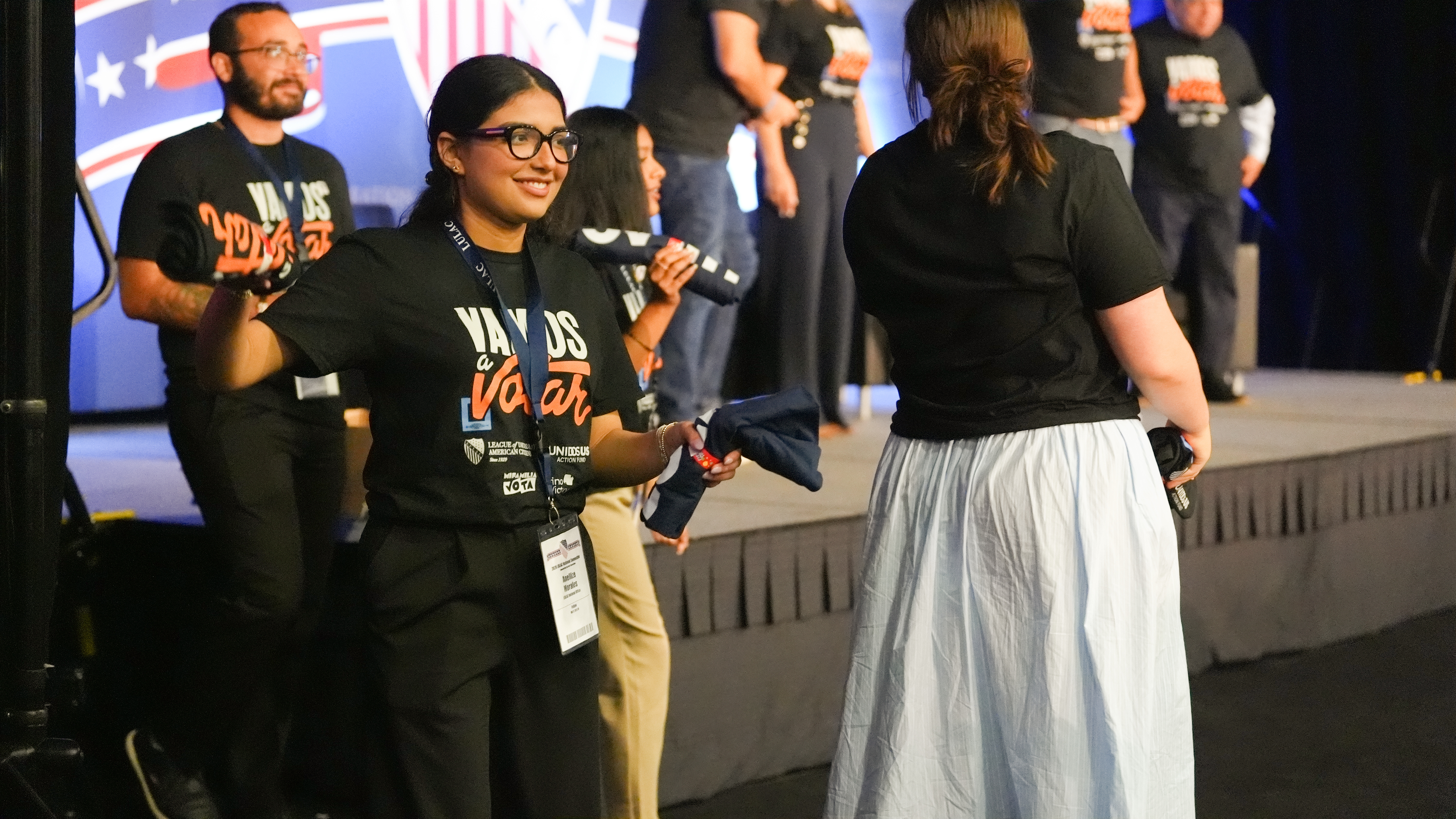 LULAC volunteers distributing Vamos a Votar shirts